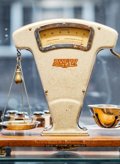 Brass balance scale weighing two sides